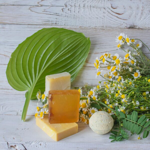 Natural handmade soap with chamomile and bath bomb. Natural handmade soap and chamomile flowers